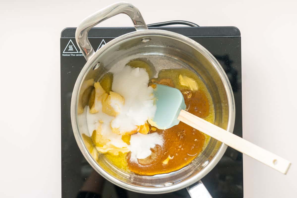 Honey, butter and sugar in a saucepan on an induction element.