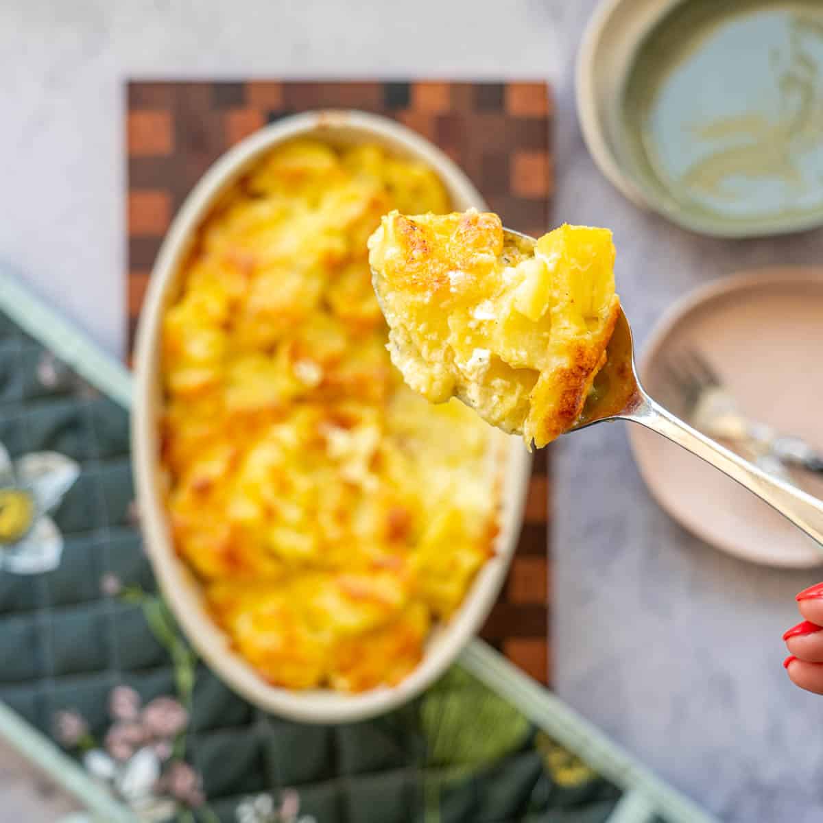 A spoonful of cheesy potatoes.