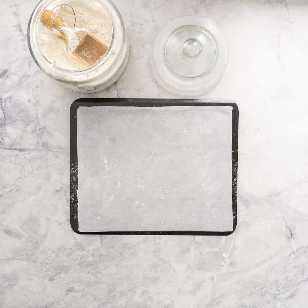 A lined and floured cookie sheet. 
