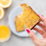 a piece of toast spread with lemon curd.