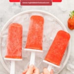 Childrens hands reaching to pick up popsicles from a bowl filled with ice with text overlay for pinterest.