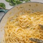 Buttery noodles in a large ceramic pan.