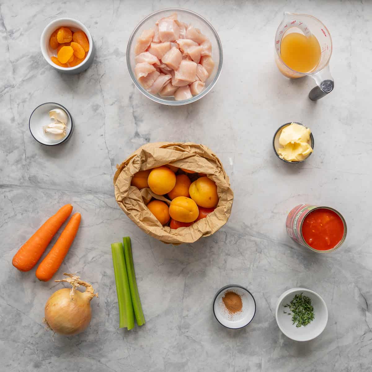 All the ingredients to make the apricot chicken laid out on the bench 