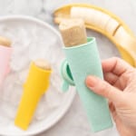A squeezee silicone tube with a frozen banana popsicle in it