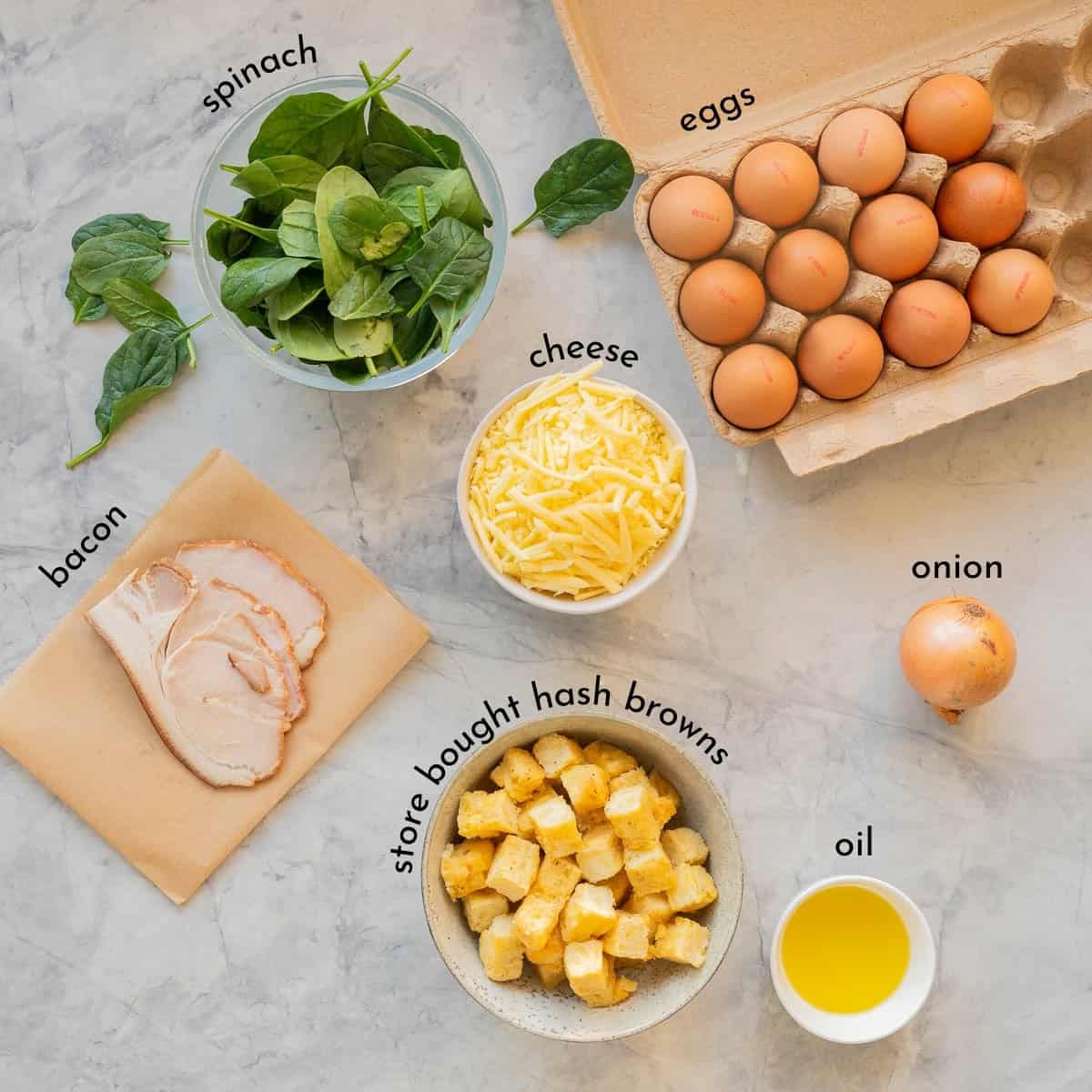 Ingredients for Egg bake with hash browns laid out on bench top with text overlay.