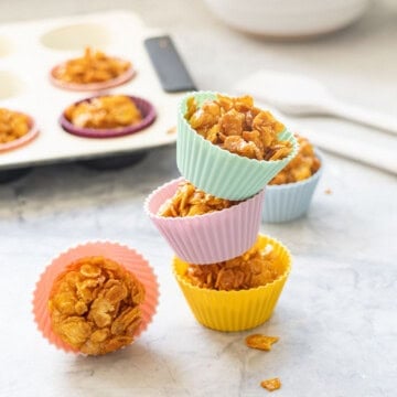 Three cornflake honey clusters stacked on top of each other.