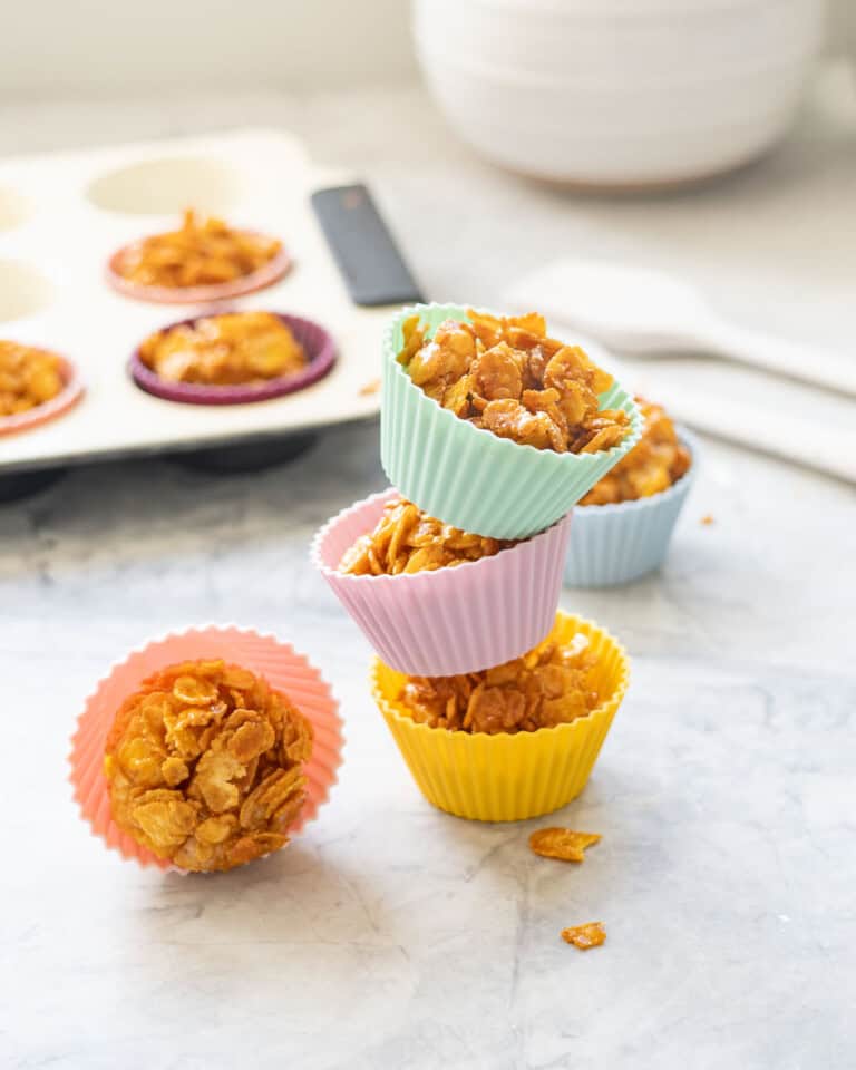 Three cornflake honey clusters stacked on top of each other.