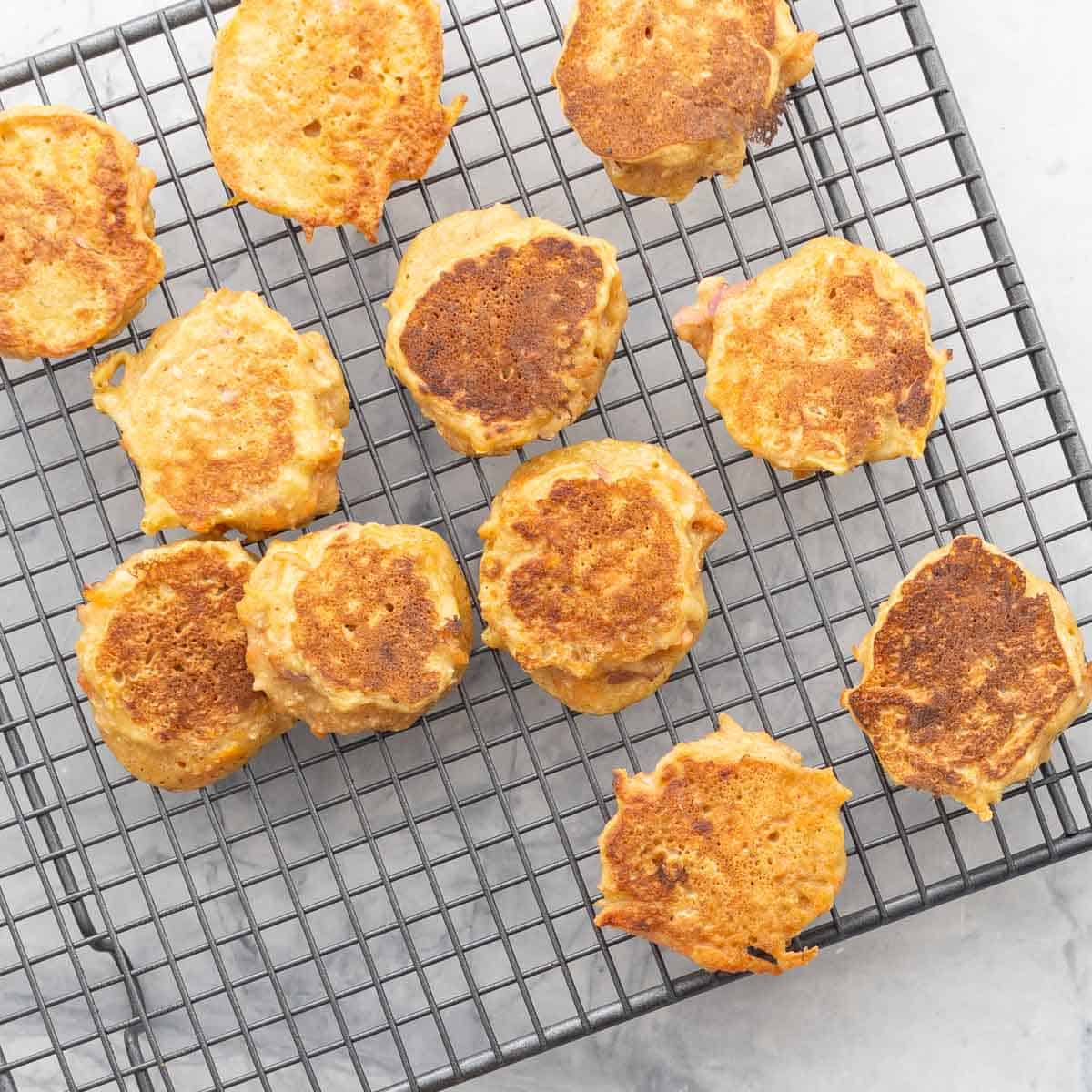 Carrot pancakes on cooling rack.