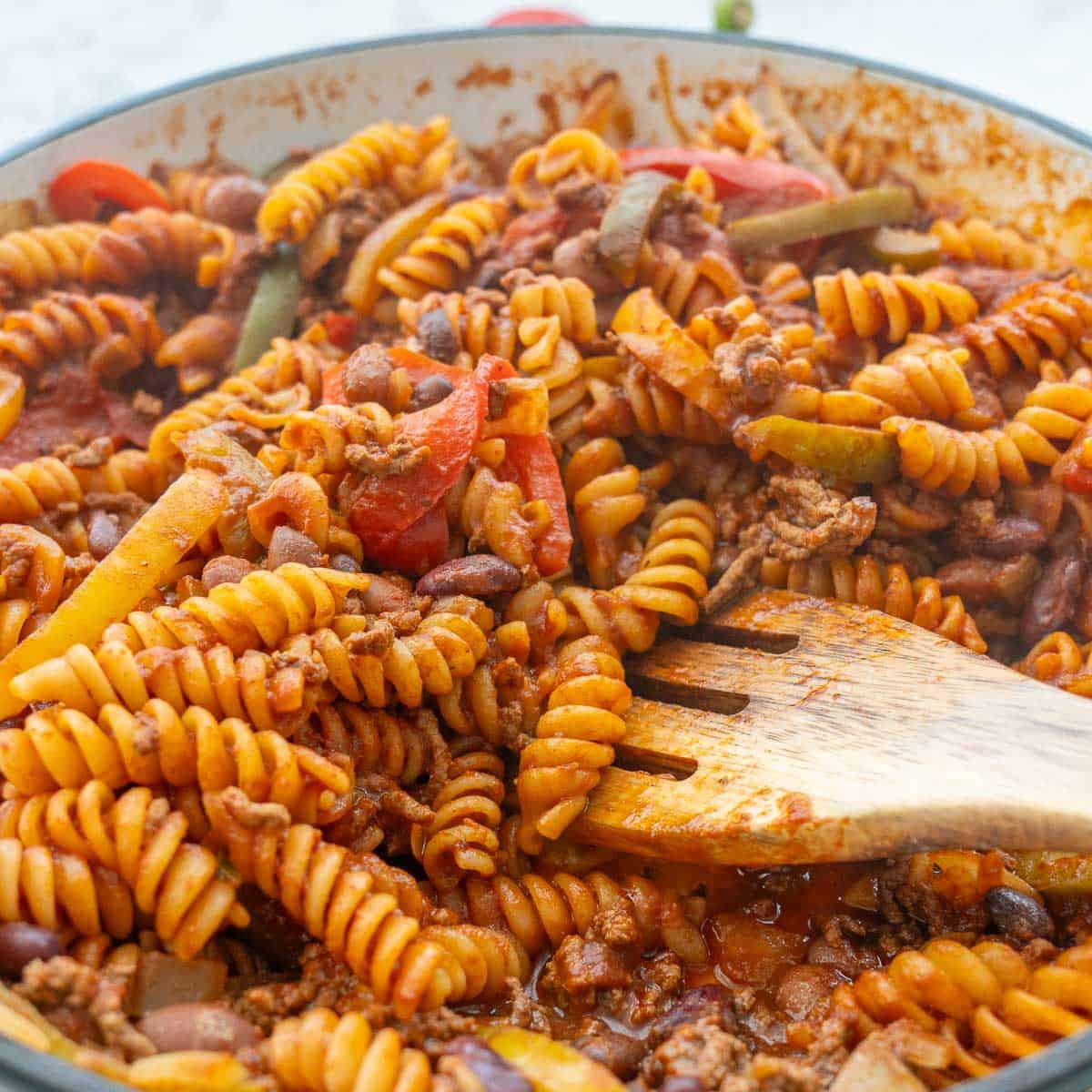 Mexican Pasta in pot with Wooden serving spoon.