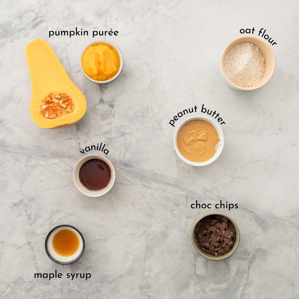 Ingredients for Pumpkin chocolate chip cookies laid out on benchtop with txt overlay.