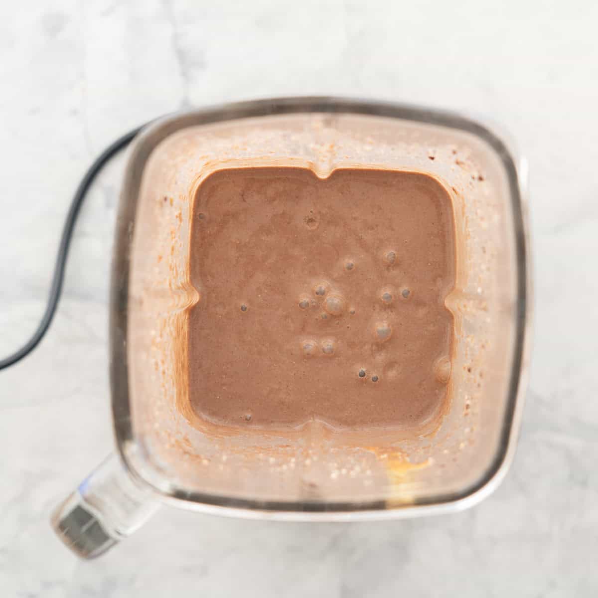 Chocolate peanut butter smoothie blended smooth in blender.