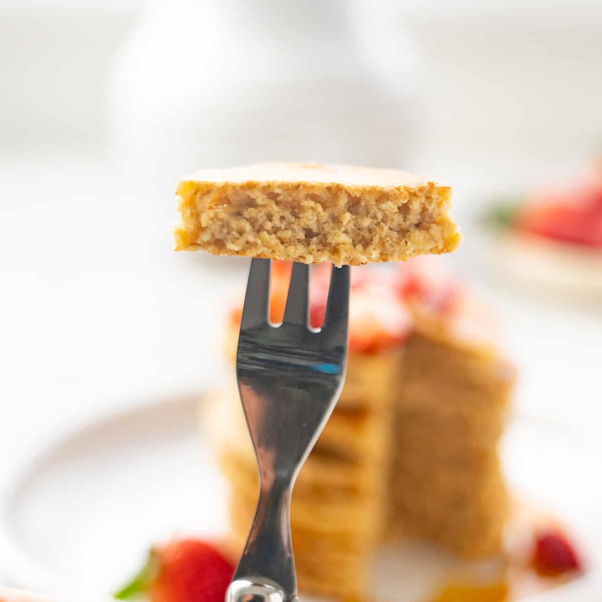 A child's fork with a bite size piece of out pancake on it.