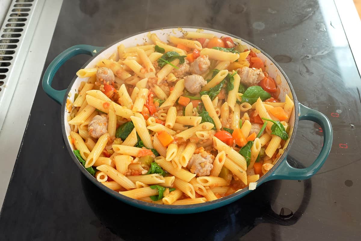 Prepared Sausage Pasta in pan on stove top.