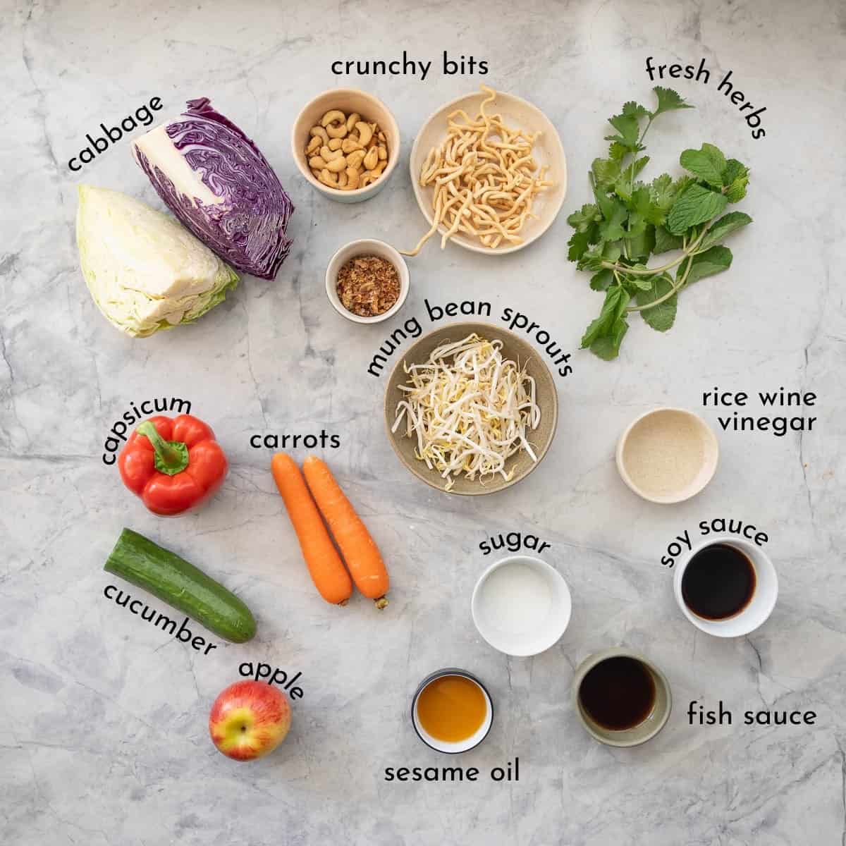 Ingredients for Asian Salad on bench top with text overlay.