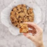 Womens hand holding a piece of monkey bread.