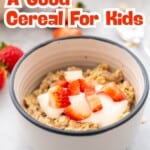 A bowl of muesli topped with yogurt and chopped strawberries. With text overlay; How to choose a good cereal for kids.