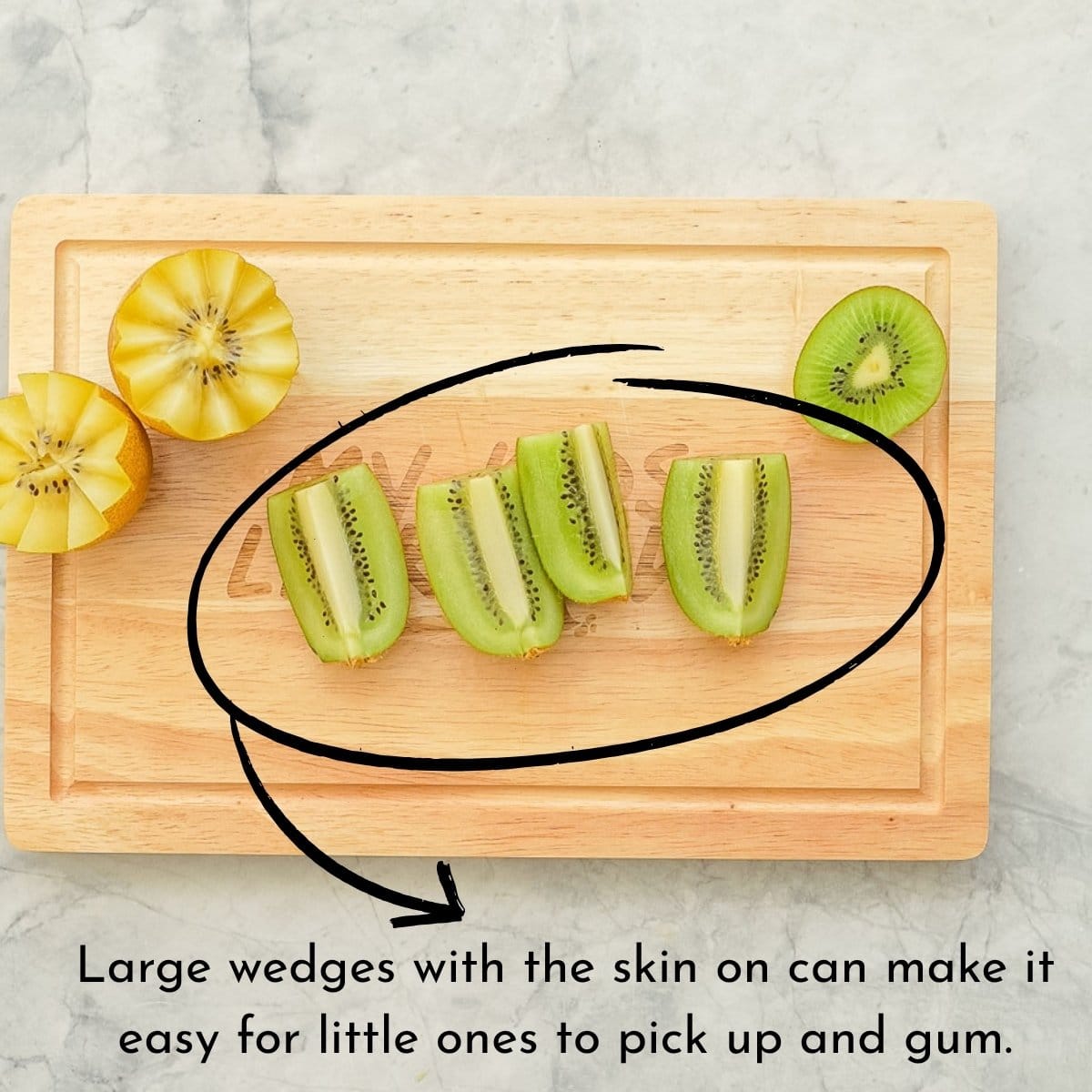 Wedges of kiwi on a chopping board with text overlay 'large wedges with the skin on can be easy for babies to pick up and gum. 