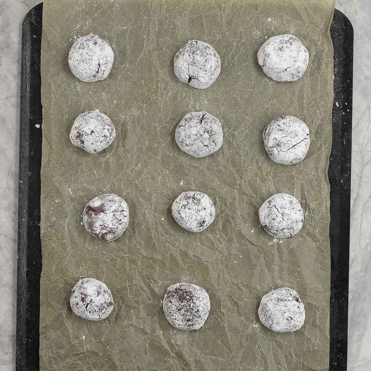 Rolled out balls on a lined baking tray coated in